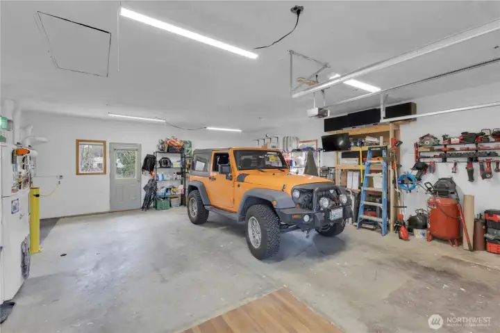 2 car garage equipped with 2 tank-less water heaters and energy efficient gas heating.