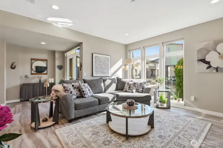 The living room is cozy yet spacious, with fantastic southern exposure filling the space with light any time of year.