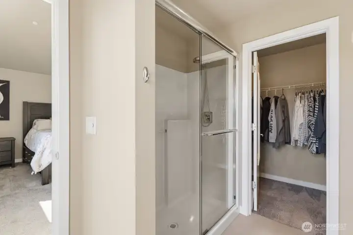 A walk-in closet ensures that all your favorite pieces always have their place.