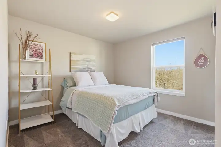 One of two additional upstairs bedrooms with great morning light.
