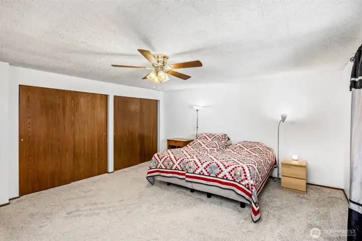 Large primary bedroom with dual closets