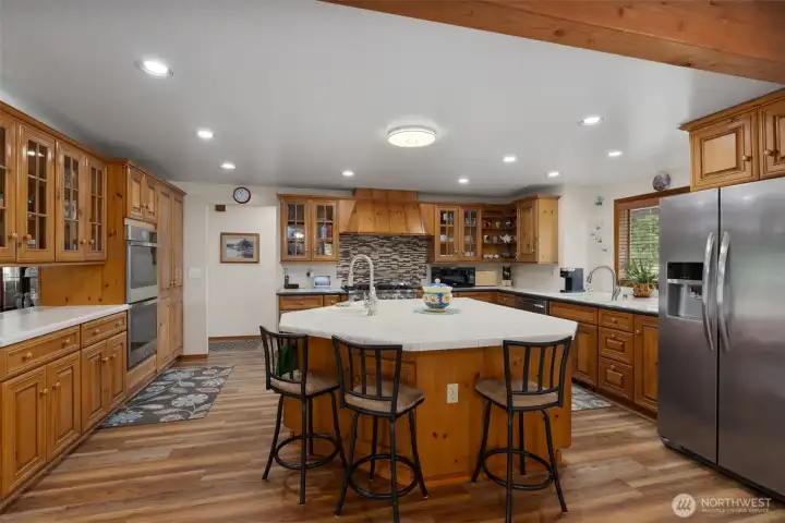 Fully equipped kitchen with center island - with sink, double oven, +range/oven with an abundance of counters space and cabinet storage.