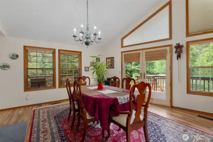 Formal dining room off kitchen and open to living room with door to deck.