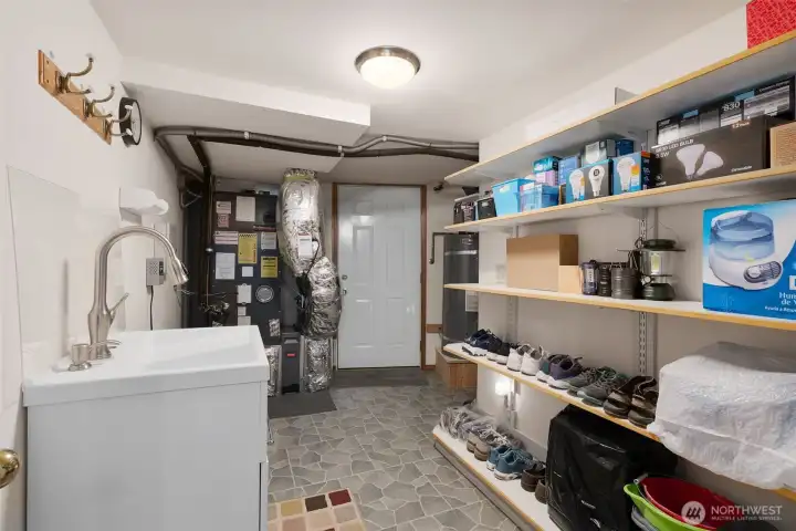 Lower Level Mud room/mechanical room - door to outside straight ahead
