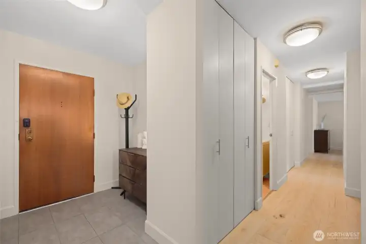 Lovely entry way nook and large entry closet in hallway.