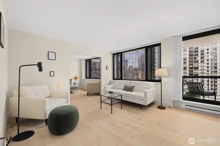 Wide plank hardwood oak floors set the tone throughout the unit. Light, bright, and tons of space for multiple seating areas!