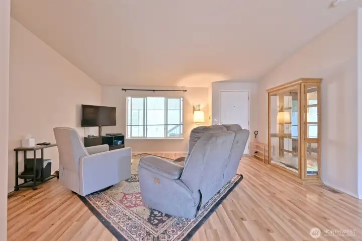 Large windows in the living room provides natural light Large windows in the living room provides natural light