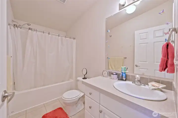 Also in the hallway by the bedrooms is the main guest bathroom, with a tub. Also in the hallway by the bedrooms is the main guest bathroom, with a tub.