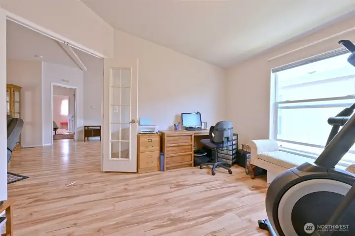 Stylish glass french doors separate the office from the living room Stylish glass french doors separate the office from the living room