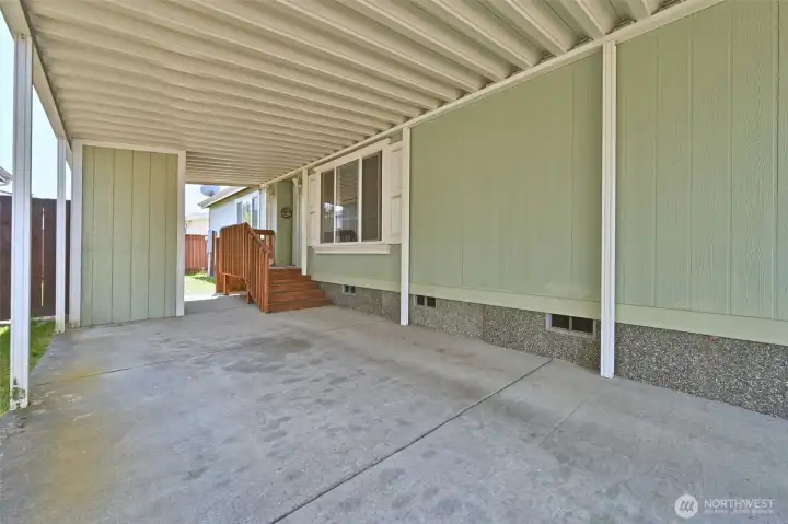 Front Carport, with a gate to the yard and storage shed. Front Carport, with a gate to the yard and storage shed.