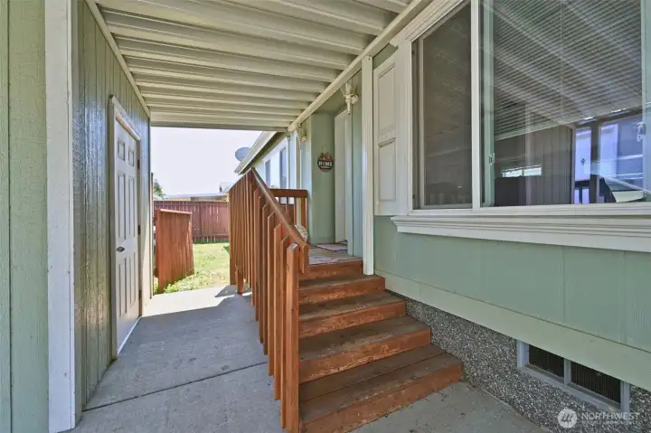 Front entry, with a gate to the yard and storage shed. Front entry, with a gate to the yard and storage shed.