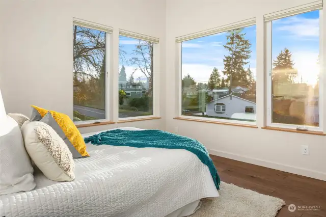 Third top floor bedroom perched high above the street and flooded with natural light from large picture windows