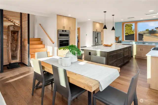 Spacious dining area opens to large high-end kitchen