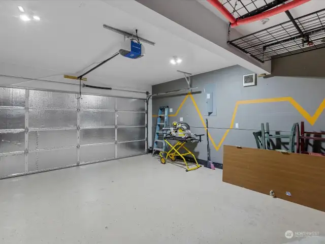The garage has lots of storage including a pulley system and apoxy floor.