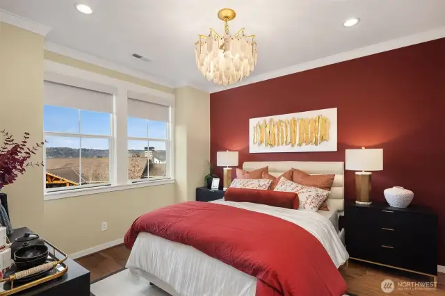 Beautiful bedroom in rich jewel tones, located on main living level