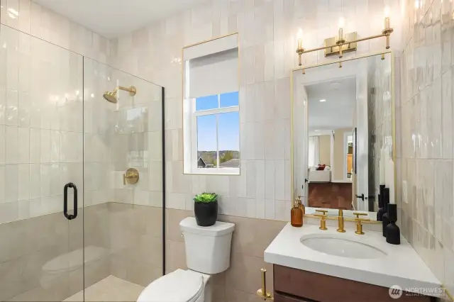 Full bath located on main floor living level - features gorgeous full tile walls!