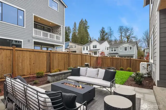 Professionally landscaped, fully fenced, sprinkler system for convenient watering, peaceful water feature & extended patio.