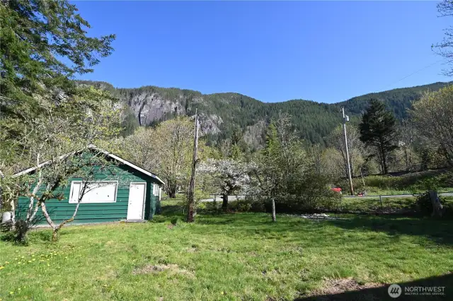 4 CITY LOTS ~ Expansive (fully fenced yard) to host gatherings. Extra Parking on Crescent and Ave A.