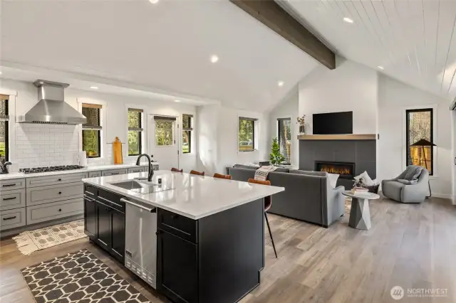 Beautiful Great Room design with vaulted T&G ceilings and stained beam