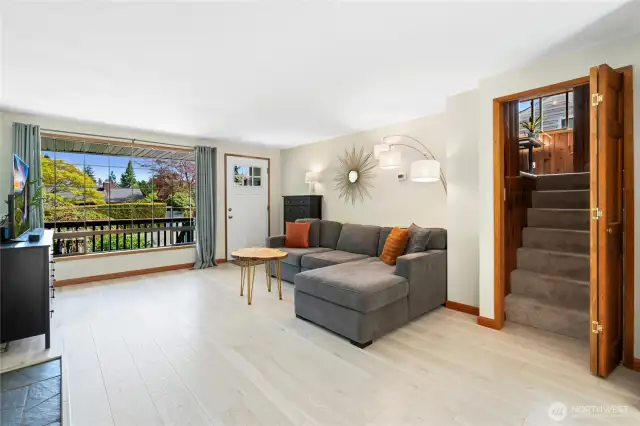 Entry, living room and entrance to upstairs bedroom or office.