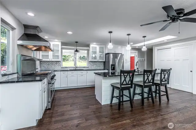 A view of this kitchen, lots of light and storage space