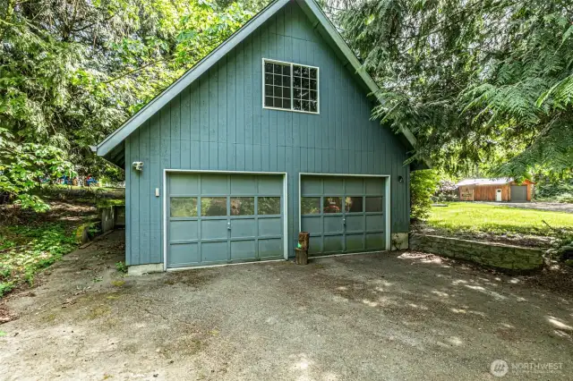 Detached 2 car garage, there's shop space with a wood stove