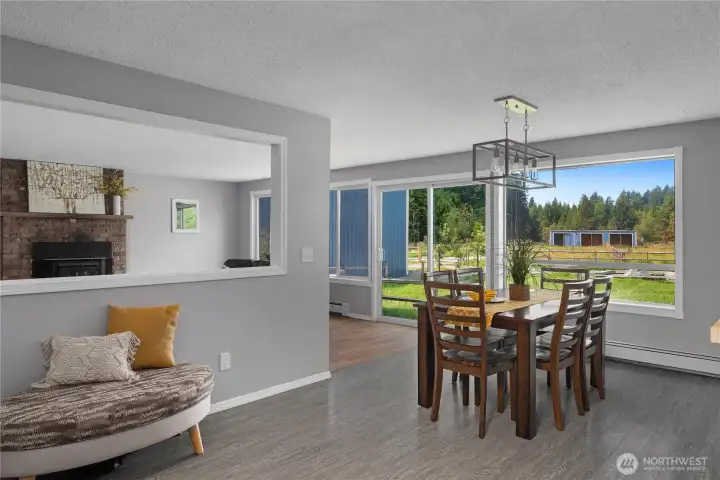 Open dining room with views of backyard & pastures