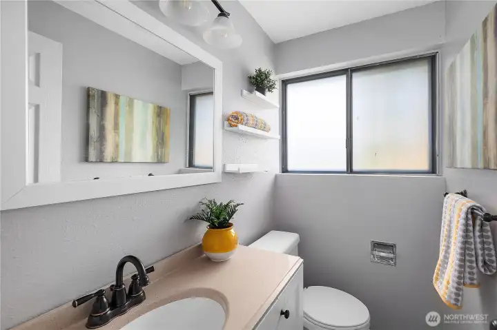 1/2 bath off of laundry room and bonus/alternative primary bedroom