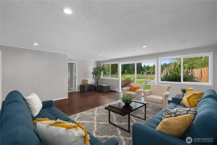 Bonus room/alternative primary bedroom which has views of the backyard & pastures and includes a patio space