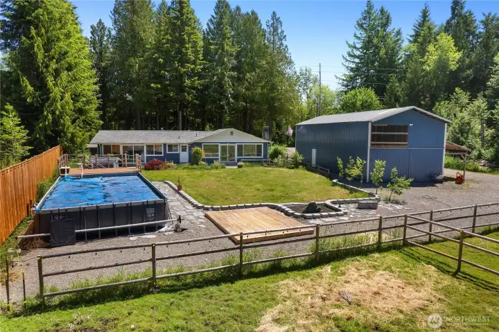 Add a pool or greenhouse on the gravel pad, Deck can be used for dining or relaxing in the evening sun!