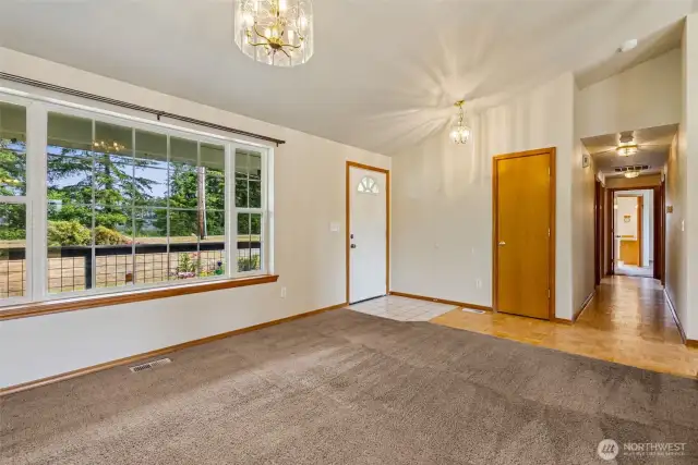 Living Room w/ Wood Stove & Big Windows