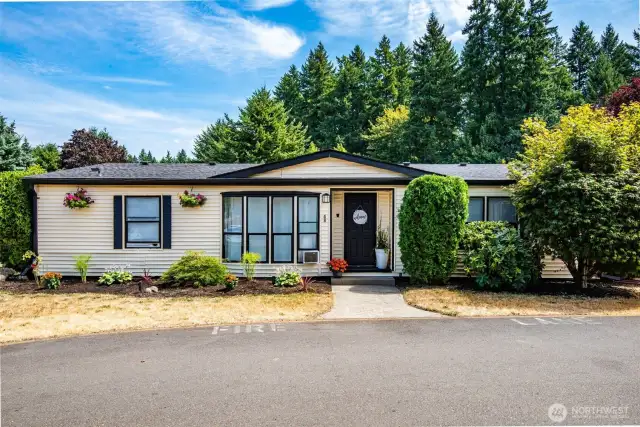 You'll love this corner-lot home with covered front entry, freshly painted trim, mature landscaping & great curb appeal.