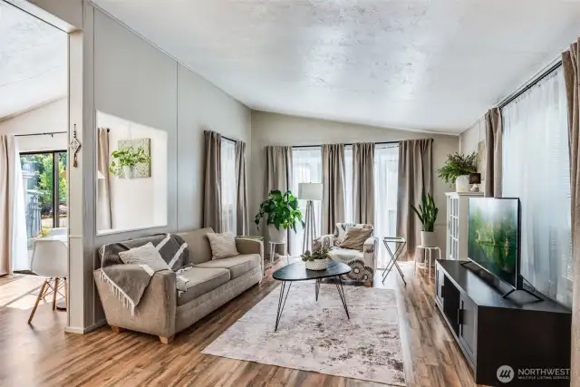 Open-concept layout with vaulted ceilings between living and dining areas—great for everyday comfort or entertaining.