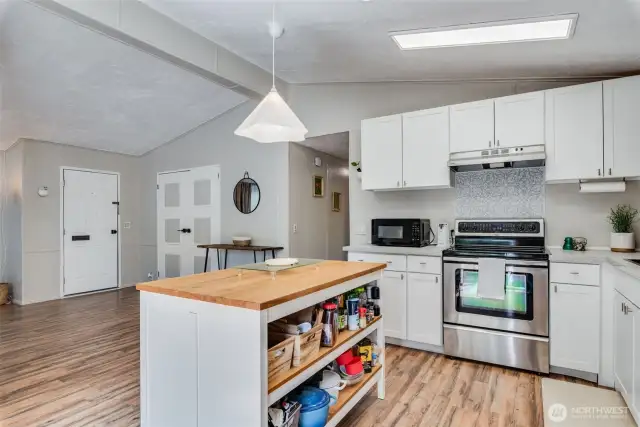 Open kitchen layout w/center island is great for entertaining.