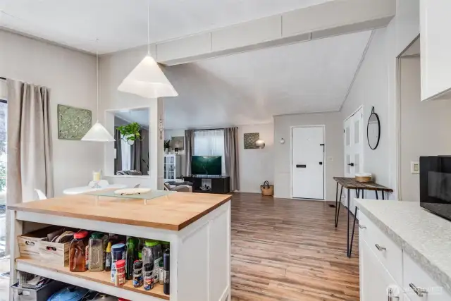 Open concept, complete w/NEW laminate flooring, provides the perfect space for entertaining and everyday living.