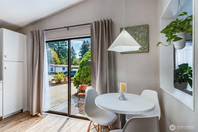 Sliding door off of kitchen leads to private outdoor space for indoor-outdoor flow.
