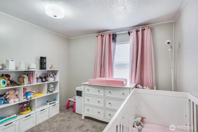 Another view of the bedroom shows the neutral palette, making it an easy conversion for guests too.