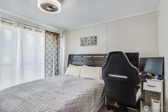 The freshly painted 3rd bedroom is located opposite the living room; it features French door entry, plush carpet, large windows & closet.
