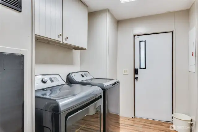 Well appointed laundry area with back entry—perfect for everyday convenience.