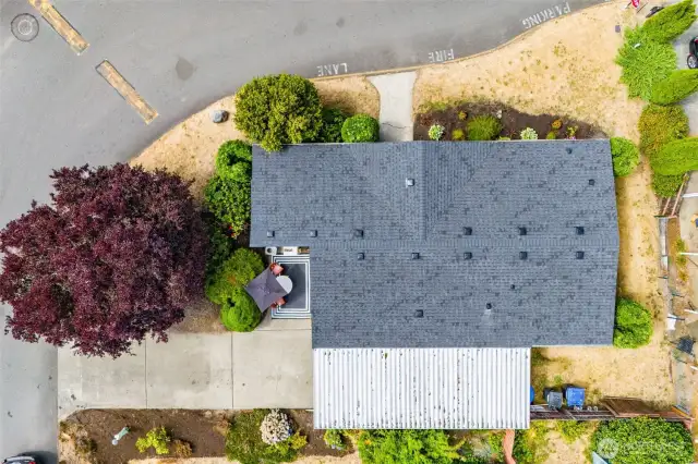 Overhead view of the home shows the corner lot setting and NEW ROOF (2020).
