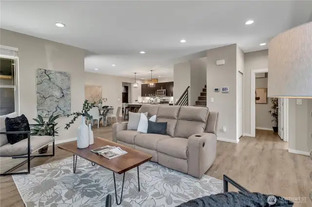 Open concept living leads into the eating area and kitchen.