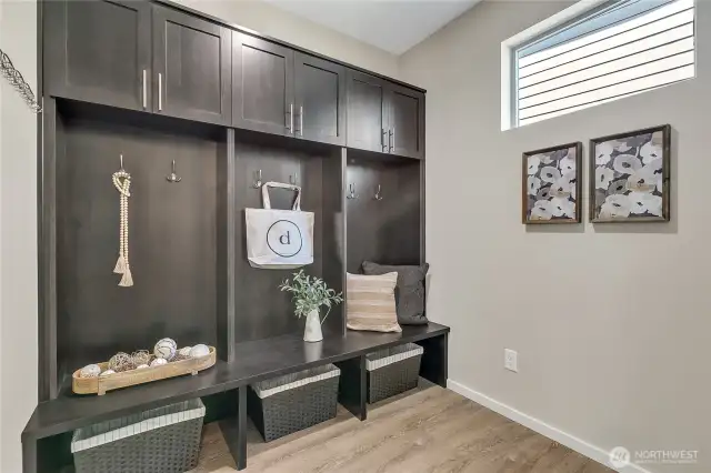 Custom built-ins provide organiztion as you enter from the attached garage.