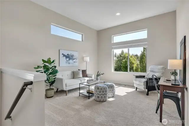 Bright and open loft greets you at the top of the stairs.