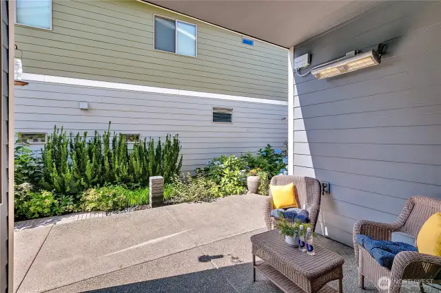 Covered Exterior Patio features a wall mounted television and exterior patio heater.