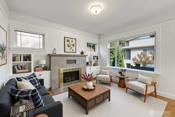 Virtually staged - Spacious living room with hardwood floors and a wood-burning fireplace