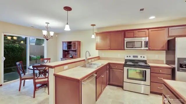 The dining room is just off of the kitchen with sliding glass doors to the back yard and patio.