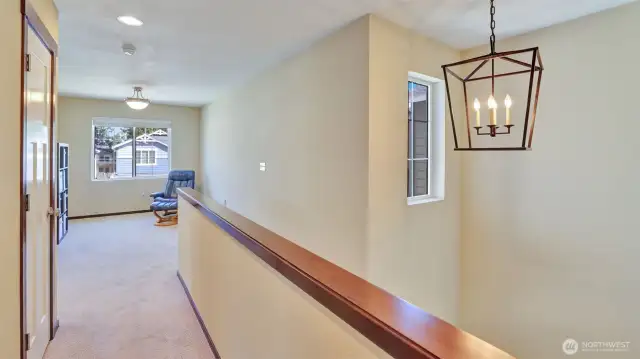 The upper level begins with a room that can be a den or a small bonus room.