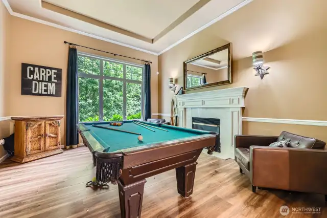The formal venues feature tray ceilings, crown molding, and chair rail.