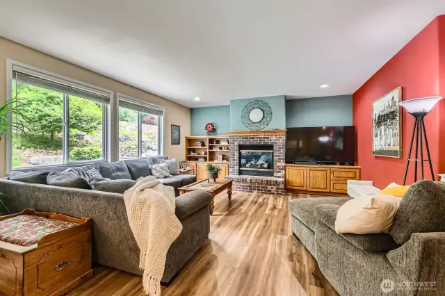 The family room with a cozy fireplace invites relaxation.