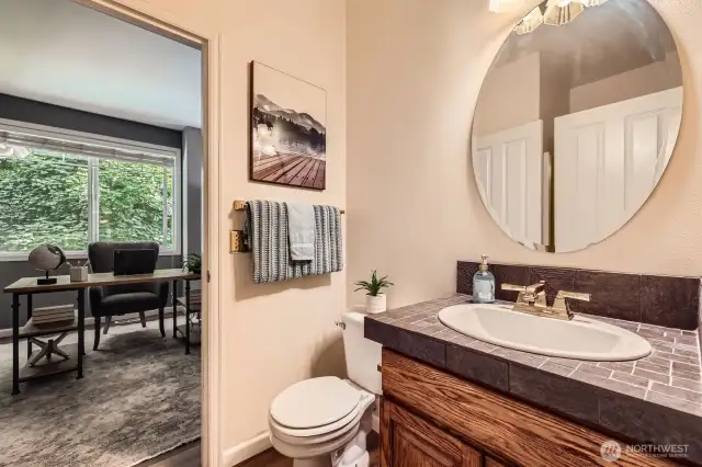 3/4 bath on the main level adjacent to den
